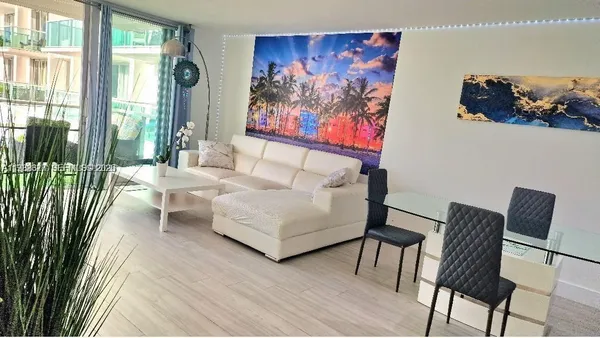 a dining room with furniture window wooden floor