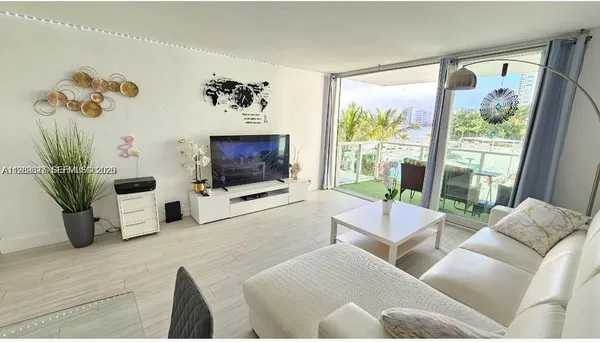 a bedroom with a bed window and a table