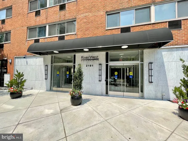 a view of a building with potted plants
