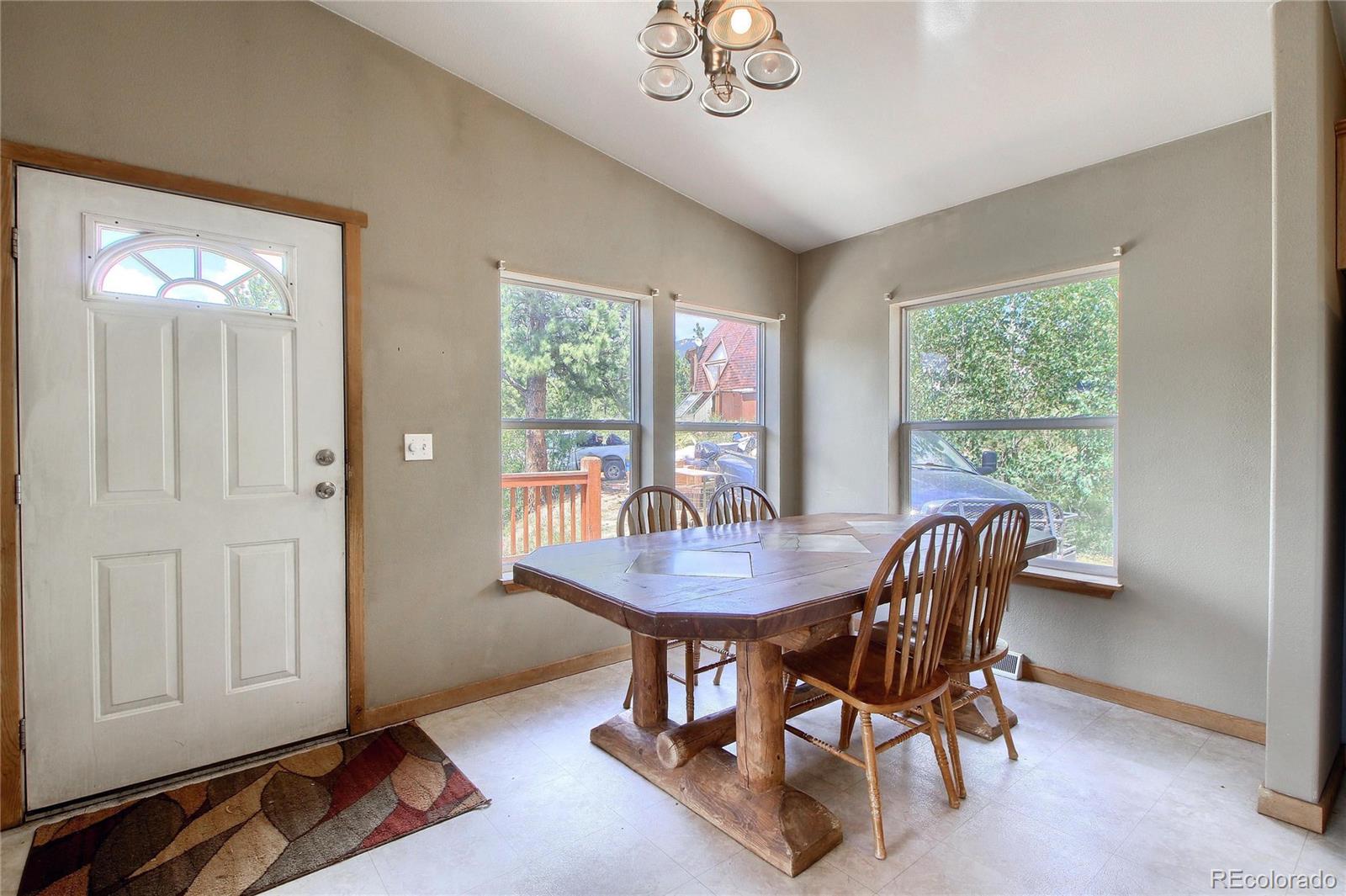 399 Buffum Street Bailey, CO 80421 - Photo 14 of 30 a view of a dining room with furniture window and outside view