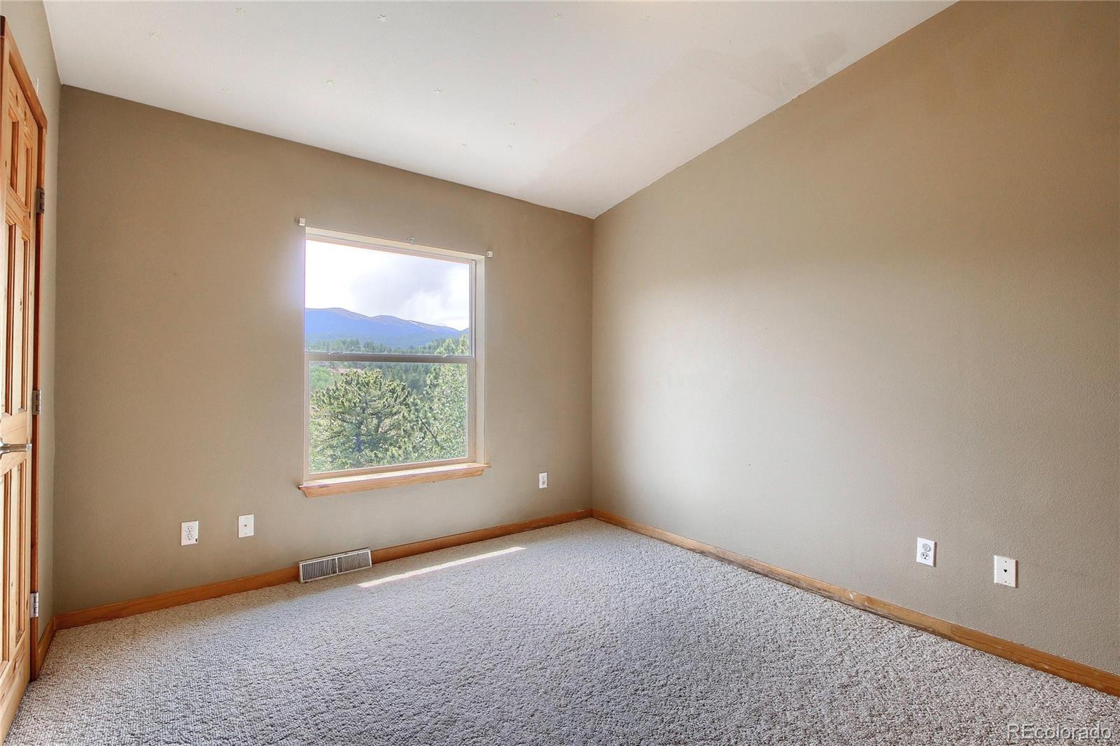 399 Buffum Street Bailey, CO 80421 - Photo 20 of 30 an empty room with a window
