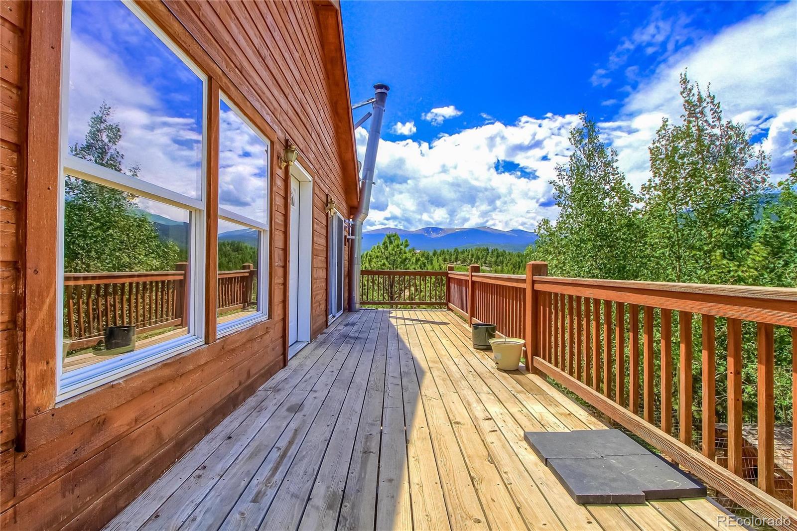399 Buffum Street Bailey, CO 80421 - Photo 3 of 30 a view of balcony with wooden floor and fence