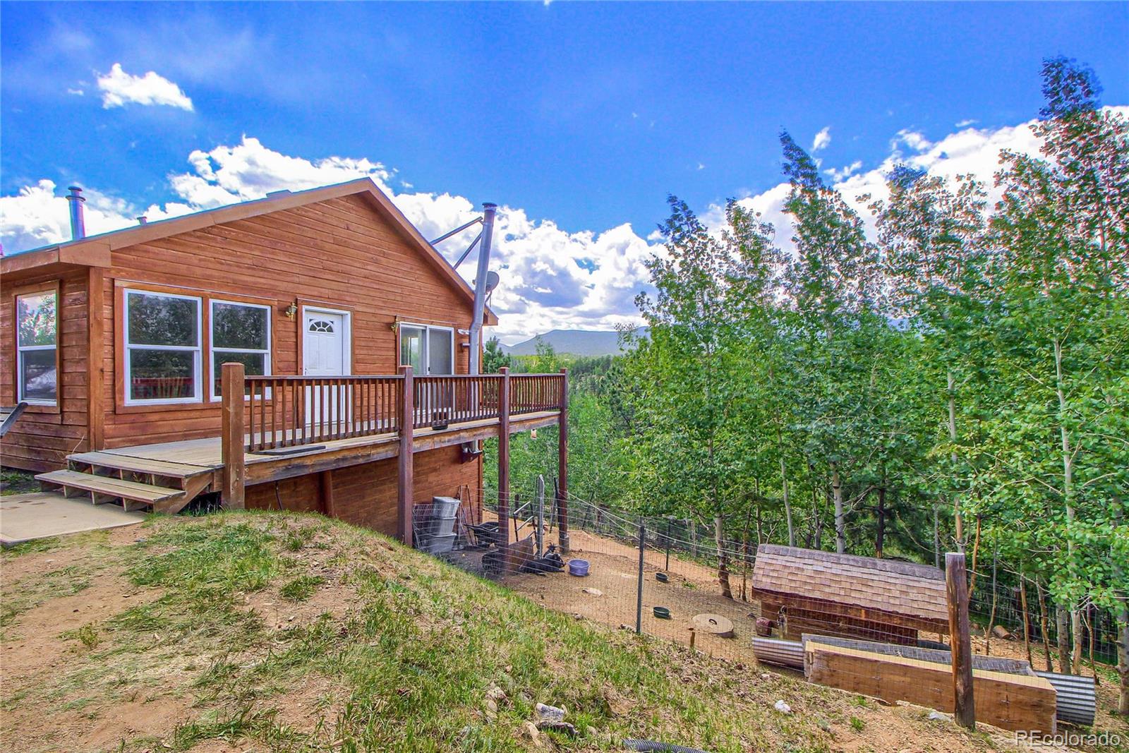 399 Buffum Street Bailey, CO 80421 - Photo 4 of 30 a view of a deck with a backyard