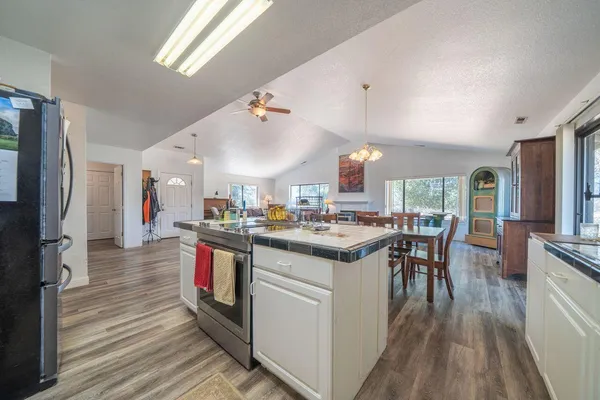a kitchen with cabinets appliances and a sink