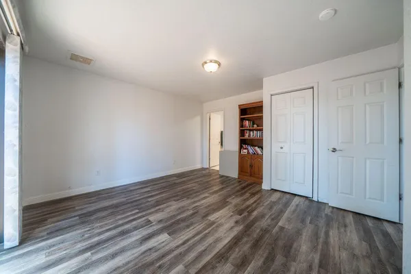 a spacious bathroom with a sink a toilet and shower