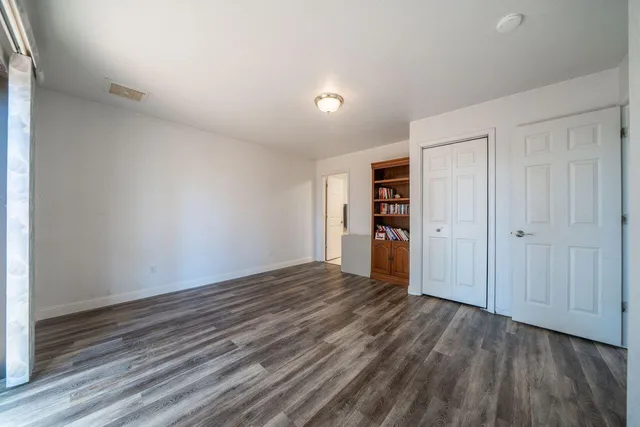a spacious bathroom with a sink a toilet and shower