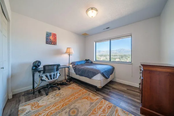 a bedroom with a bed and a closet