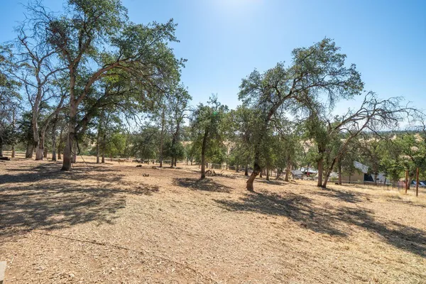 a view of a house with a yard covered in snow