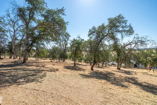 a view of a house with a yard covered in snow