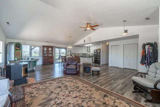 a living room with fireplace furniture and a wooden floor