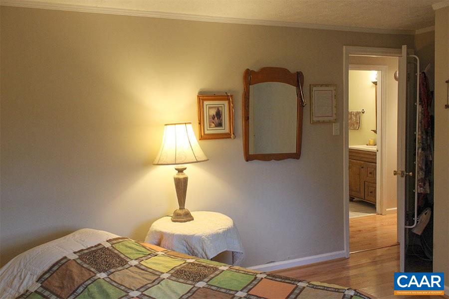 2468 Craigs Store Road Afton, VA 22920 - Photo 11 of 24 a lamp on a table and a mirror