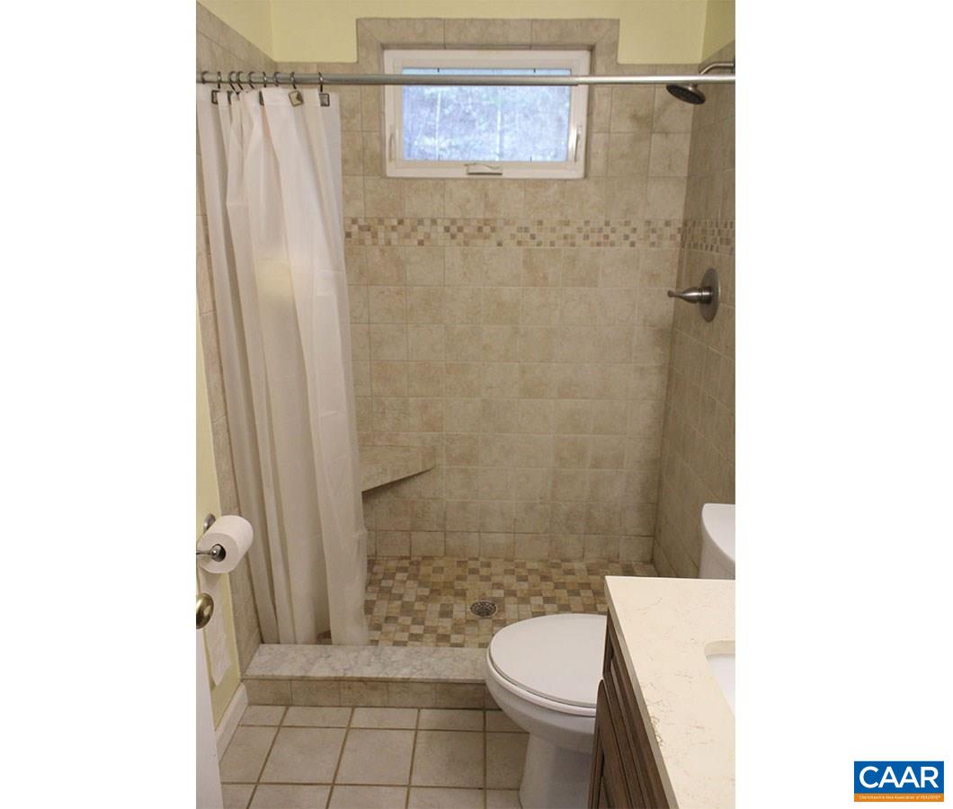 2468 Craigs Store Road Afton, VA 22920 - Photo 12 of 24 a bathroom with a toilet a sink and a shower