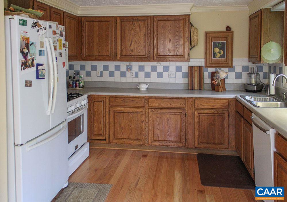 2468 Craigs Store Road Afton, VA 22920 - Photo 3 of 24 a kitchen with stainless steel appliances a refrigerator sink and cabinets