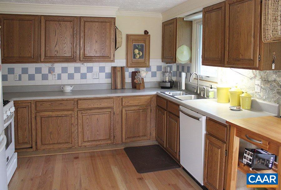 2468 Craigs Store Road Afton, VA 22920 - Photo 4 of 24 a kitchen with sink cabinets and window