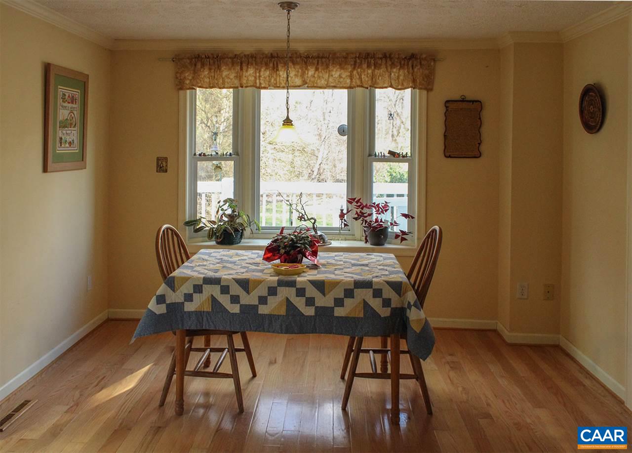 2468 Craigs Store Road Afton, VA 22920 - Photo 5 of 24 a view of a dining room with furniture window and wooden floor
