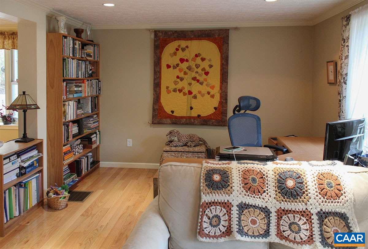 2468 Craigs Store Road Afton, VA 22920 - Photo 8 of 24 a bedroom with a bed and a book shelf