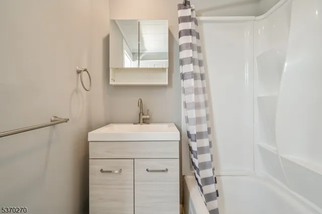 a bathroom with a sink a vanity and a mirror