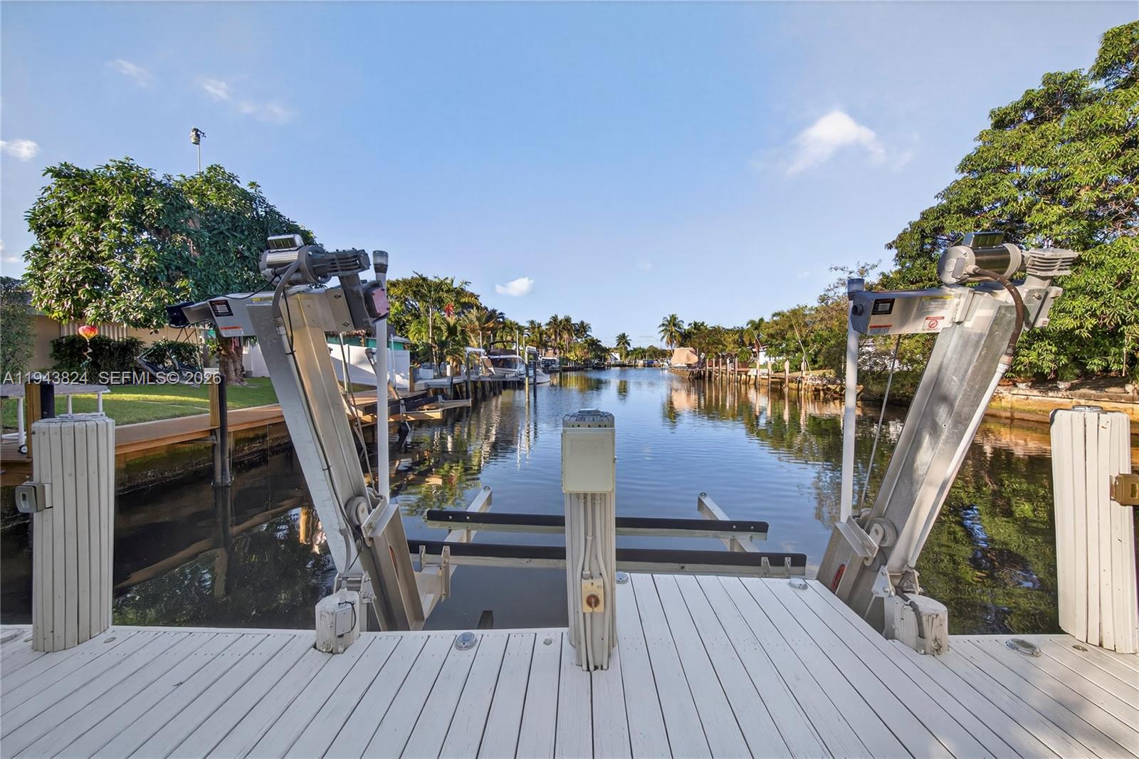 a view of a roof deck with chair and a table