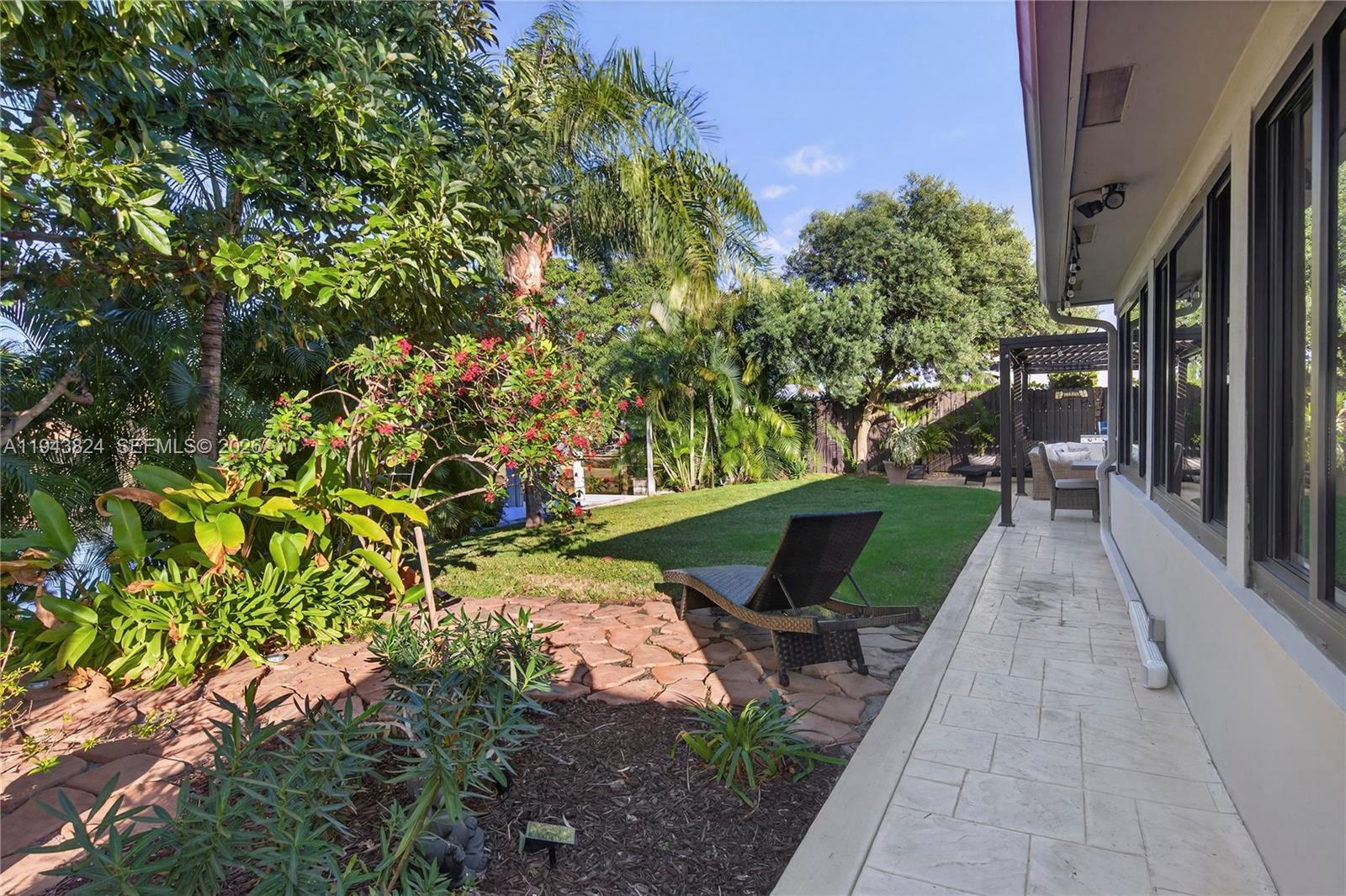 371 Southeast 3rd Street Pompano Beach, FL 33060 - Photo 23 of 87 a view of a patio with table and chairs and potted plants