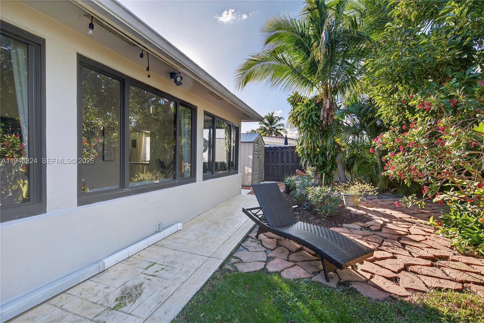371 Southeast 3rd Street Pompano Beach, FL 33060 - Photo 24 of 87 a garden view with a seating space