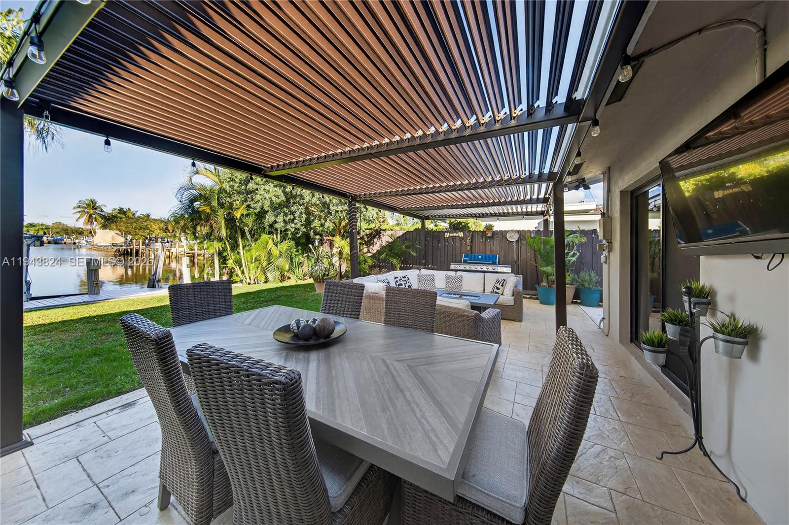 371 Southeast 3rd Street Pompano Beach, FL 33060 - Photo 26 of 87 a view of yard from deck with patio