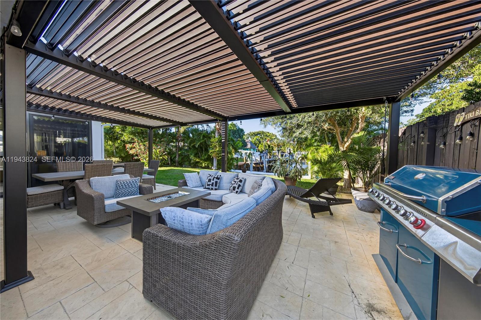 371 Southeast 3rd Street Pompano Beach, FL 33060 - Photo 29 of 87 a living room with patio furniture and a yard