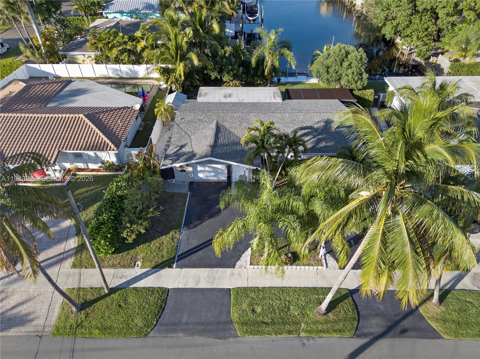 371 Southeast 3rd Street Pompano Beach, FL 33060 - Photo 3 of 87 an aerial view of a house with a yard