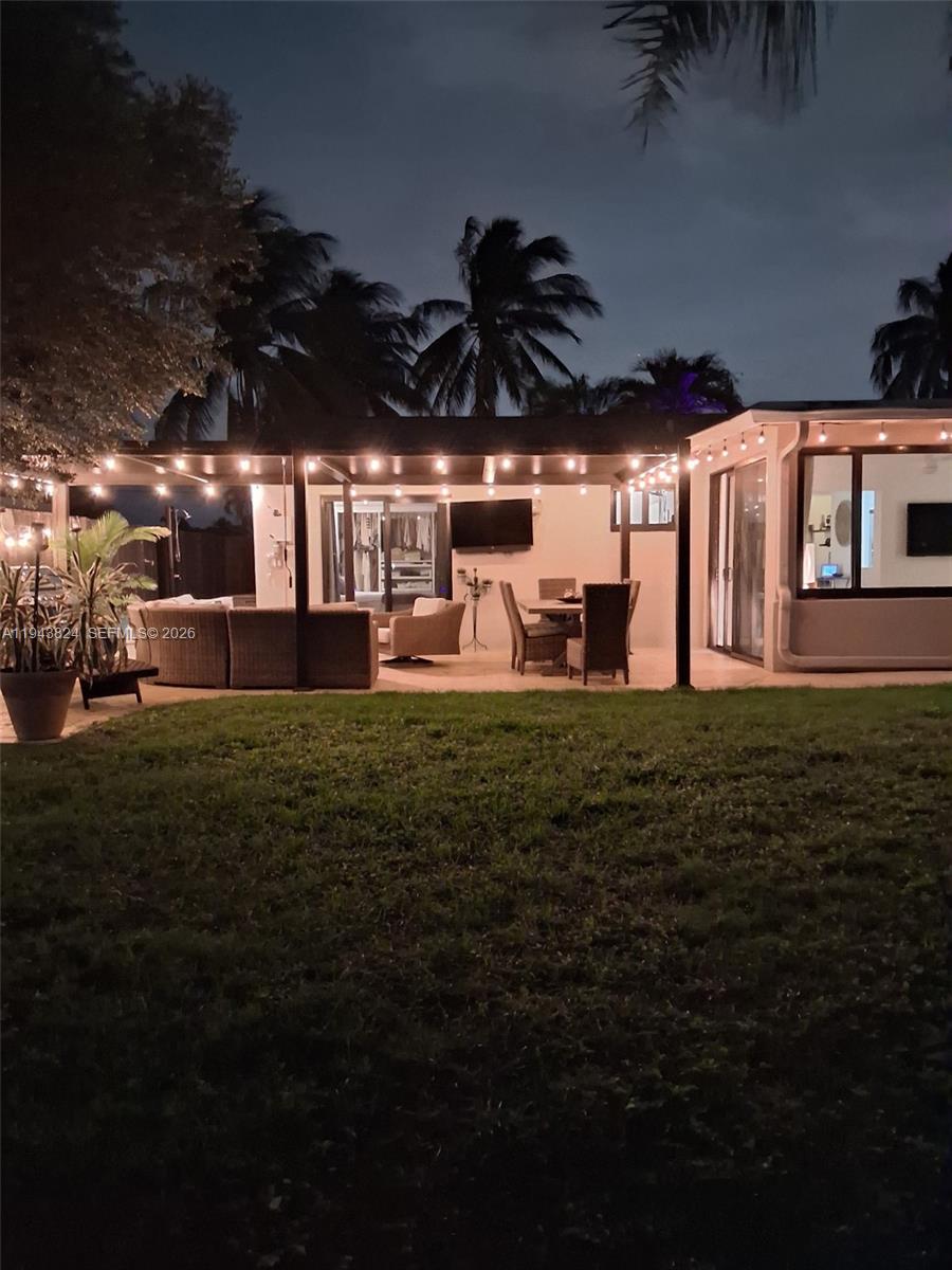 371 Southeast 3rd Street Pompano Beach, FL 33060 - Photo 80 of 87 a front view of a house with a garden