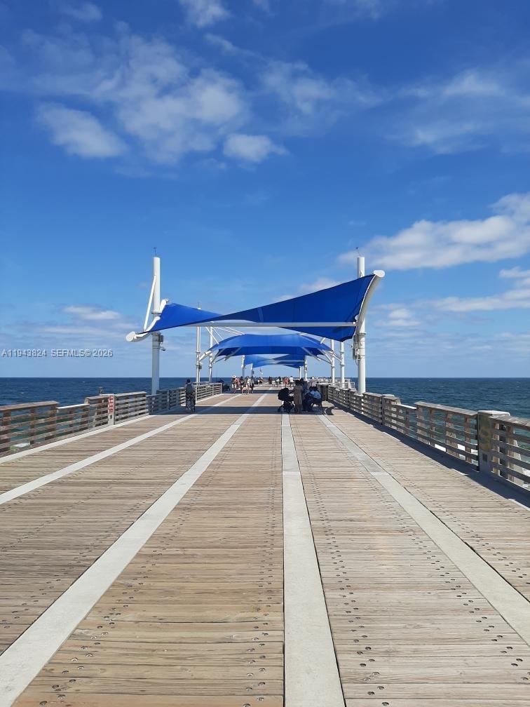 371 Southeast 3rd Street Pompano Beach, FL 33060 - Photo 84 of 87 a view of a balcony with wooden floor