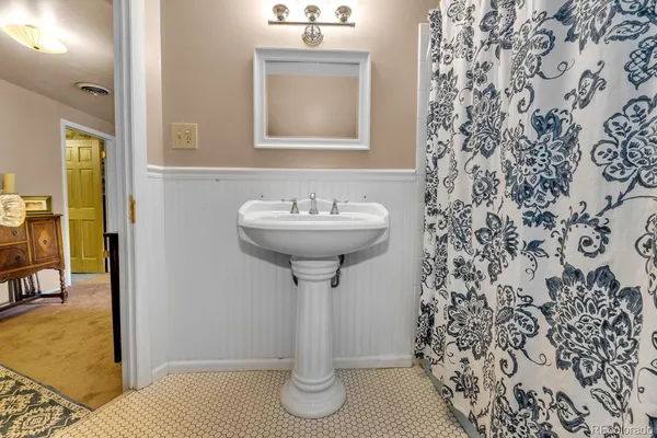 a bathroom with a sink and mirror