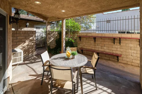 a view of a table and chairs in patio