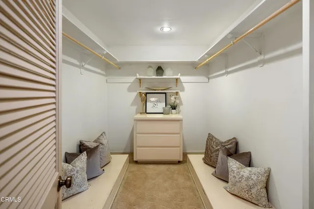 a bedroom with a bed and cabinets