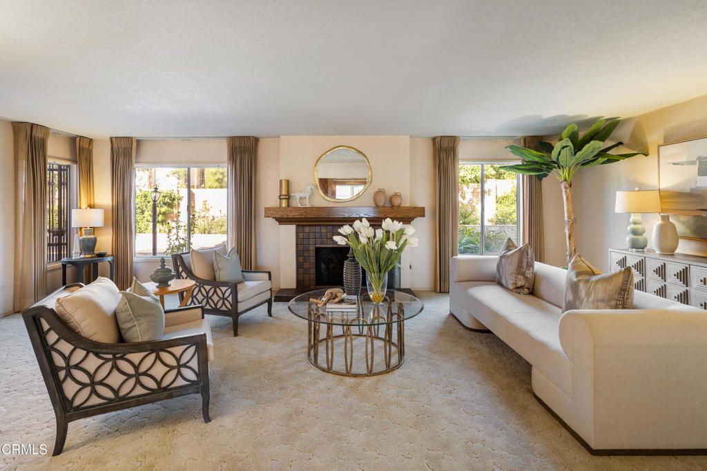 1400 Valley View Road, Unit 1 Glendale, CA 91202 - Photo 7 of 52 a living room with furniture a fireplace and a chandelier