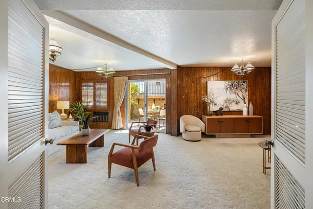 a view of a livingroom with furniture and windows
