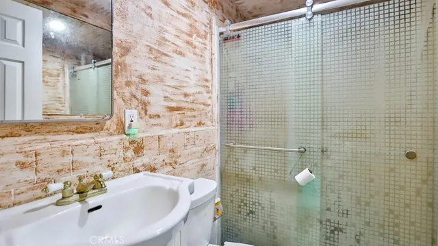 a bathroom with a sink and a shower