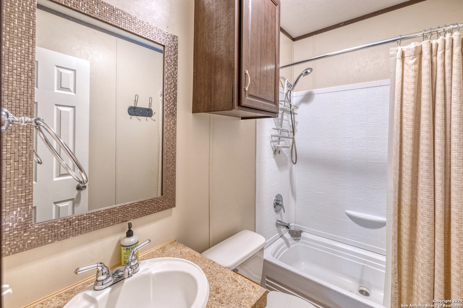 130 River Vly Road Rio Frio, TX 78879 - Photo 17 of 28 a bathroom with a granite countertop sink toilet and shower