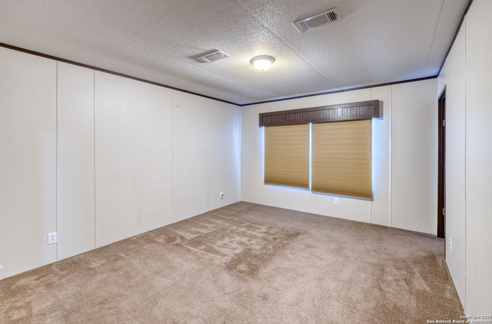 130 River Vly Road Rio Frio, TX 78879 - Photo 18 of 28 a view of an empty room with a window