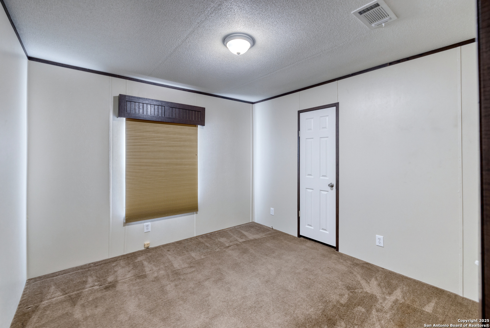 130 River Vly Road Rio Frio, TX 78879 - Photo 21 of 28 an empty room with a window