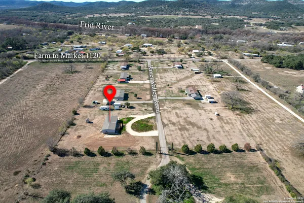 an aerial view of house with a yard