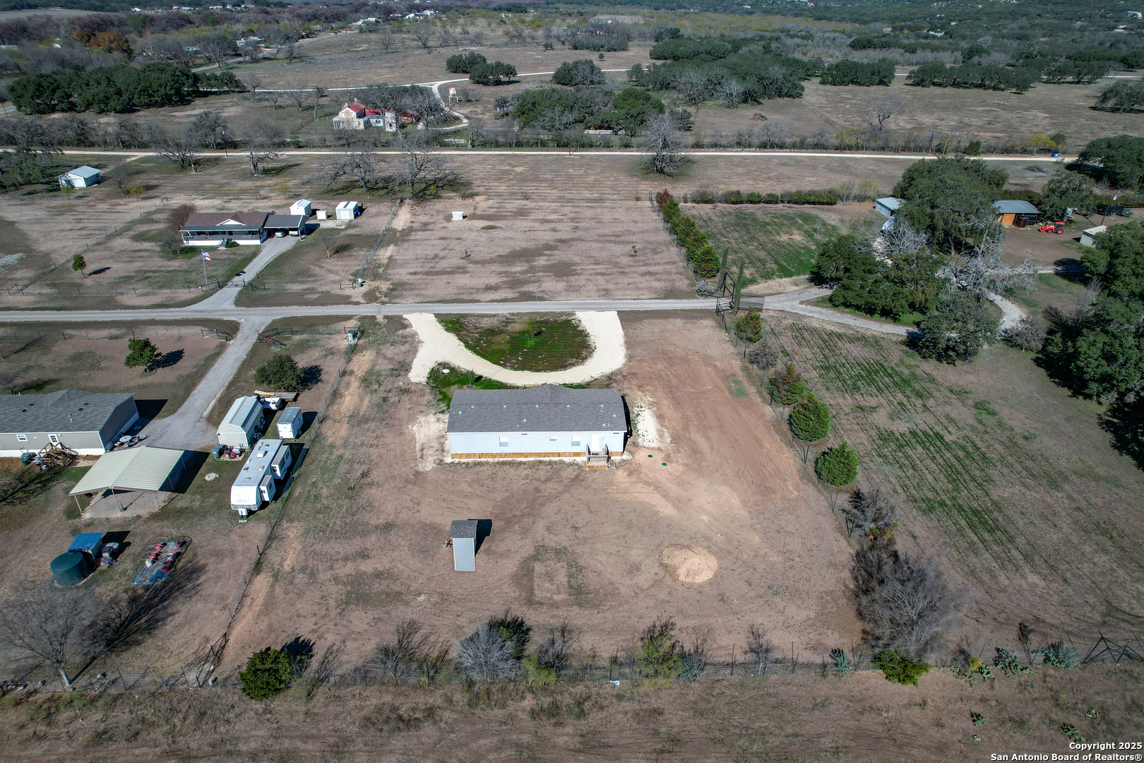 130 River Vly Road Rio Frio, TX 78879 - Photo 25 of 28 an aerial view of a house with outdoor space
