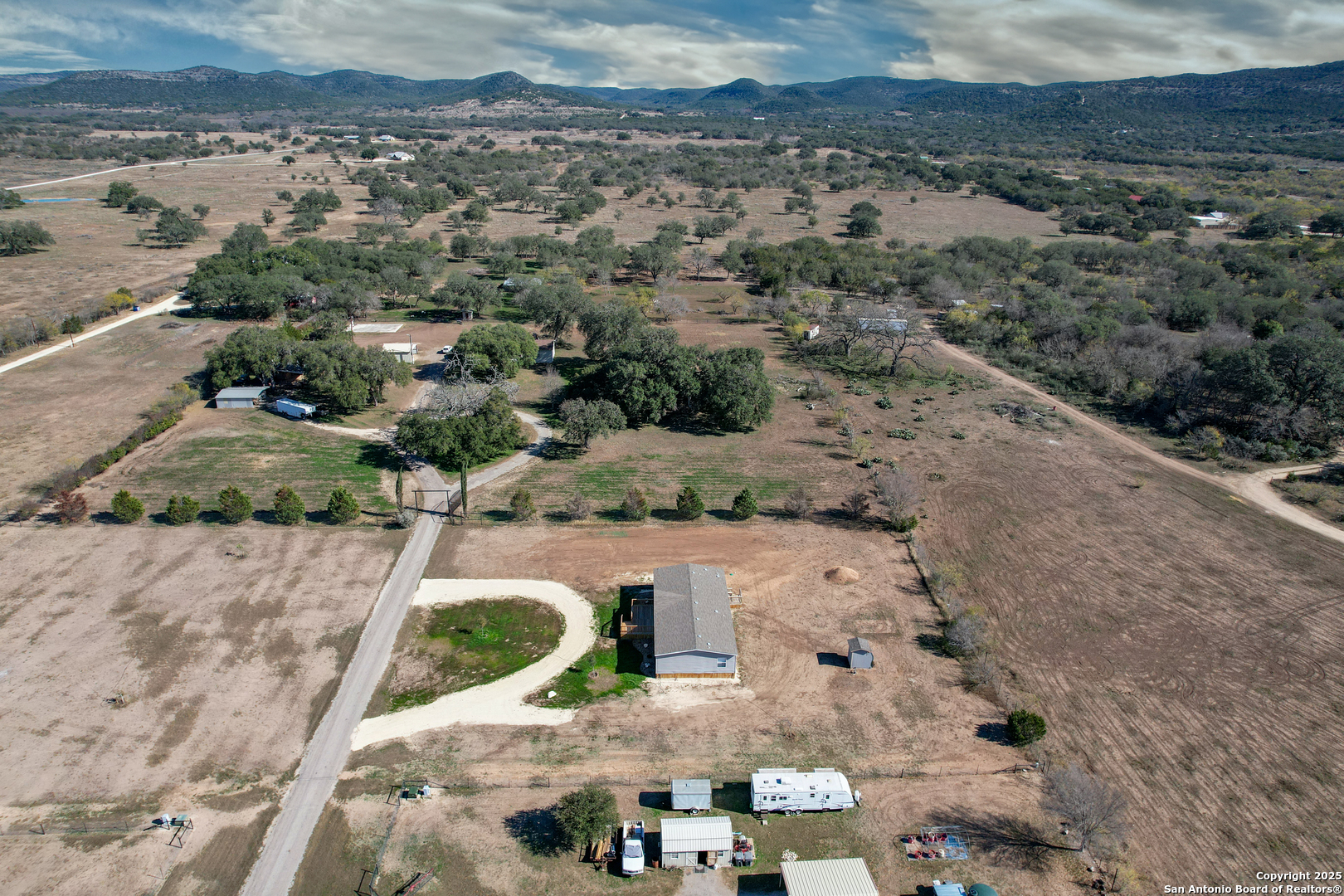 130 River Vly Road Rio Frio, TX 78879 - Photo 26 of 28 an aerial view of house with a yard