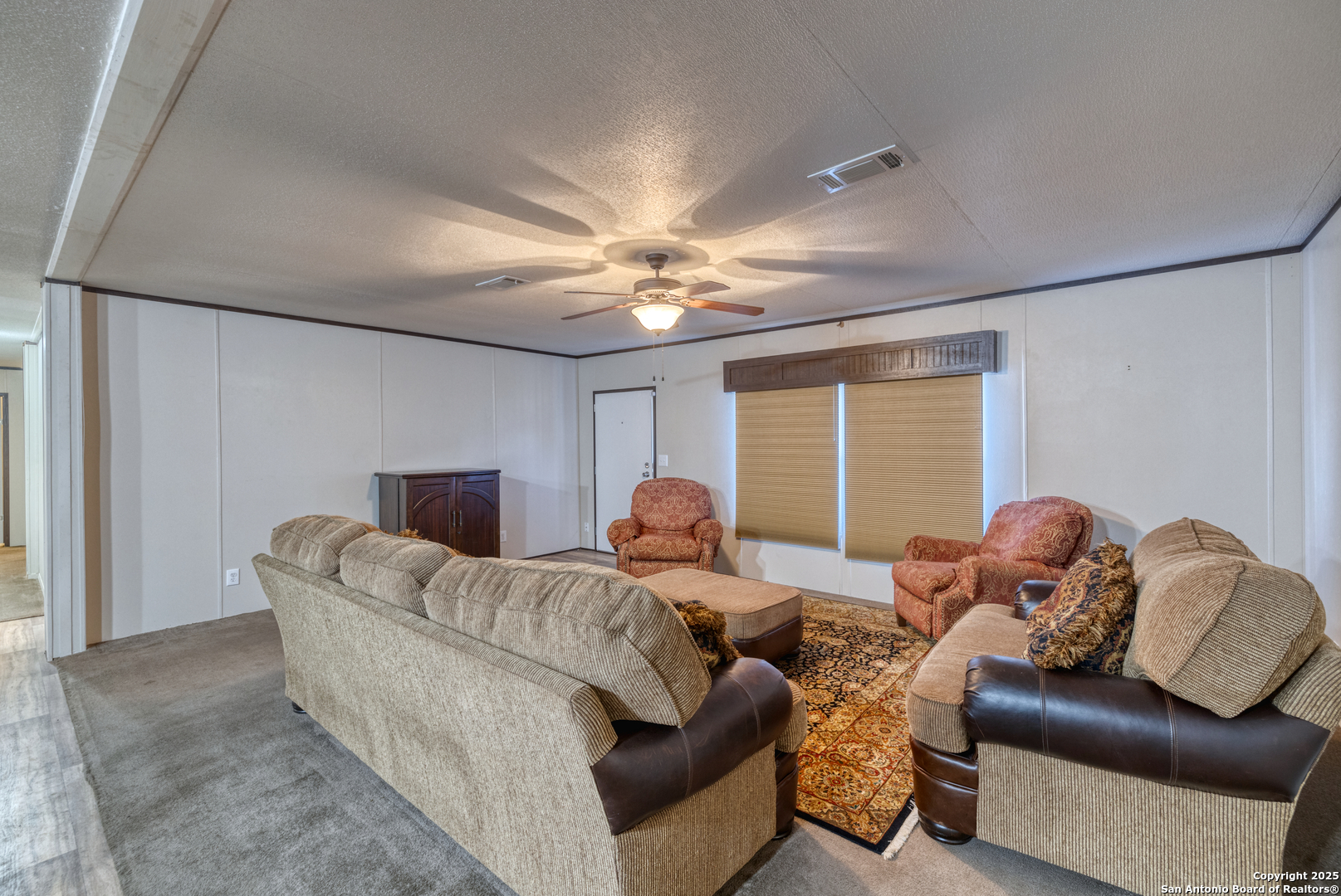 130 River Vly Road Rio Frio, TX 78879 - Photo 7 of 28 a bedroom with furniture and a large window