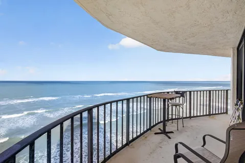 a balcony with wooden floor