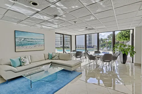 a view of a swimming pool with a yard
