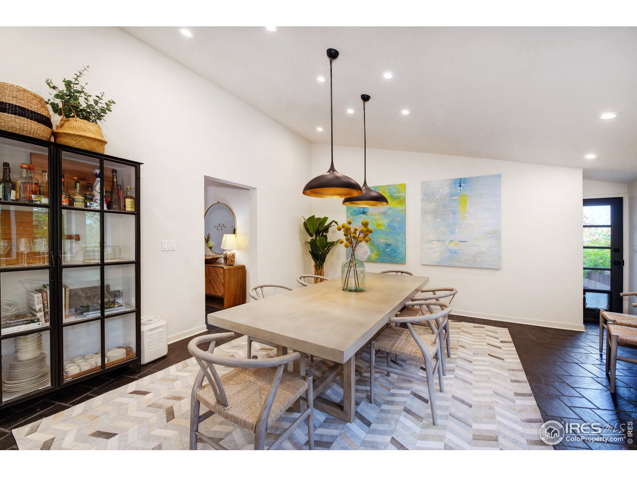 505 Geneva Avenue Boulder, CO 80302 - Photo 16 of 40 a view of a dining room with furniture a chandelier and wooden floor