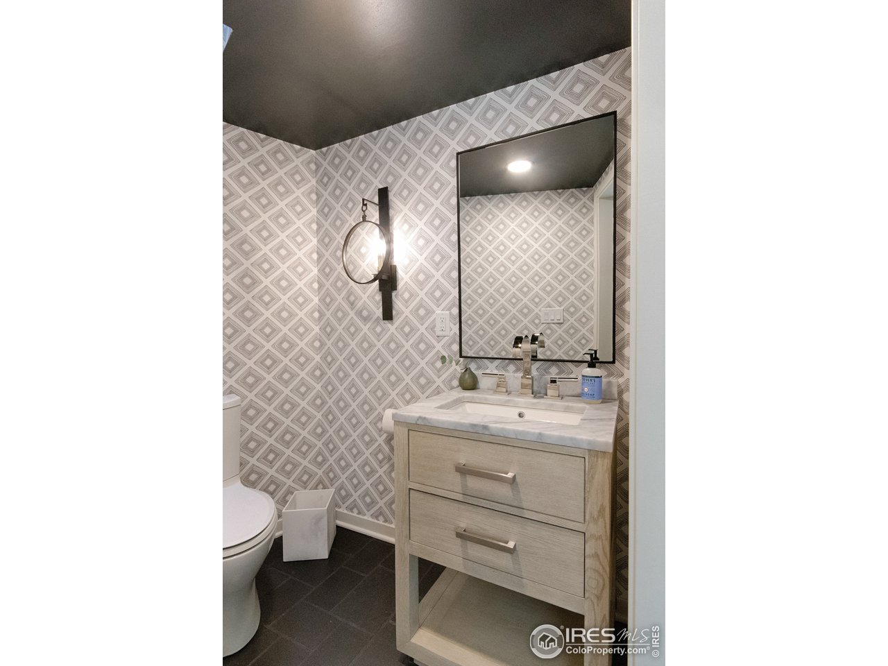 505 Geneva Avenue Boulder, CO 80302 - Photo 19 of 40 a bathroom with a toilet sink and mirror