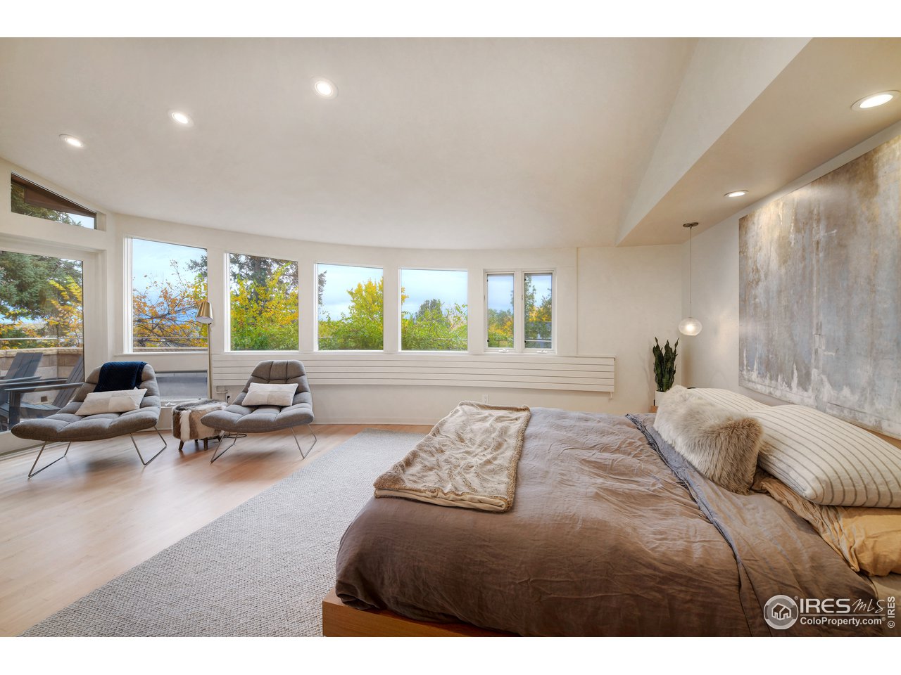 505 Geneva Avenue Boulder, CO 80302 - Photo 22 of 40 a bedroom with a large bed and furniture