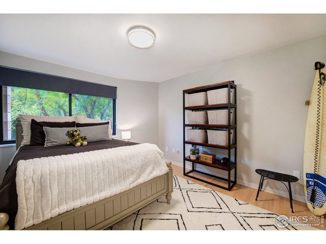 505 Geneva Avenue Boulder, CO 80302 - Photo 27 of 40 a bedroom with a bed a window and walk in closet with large window
