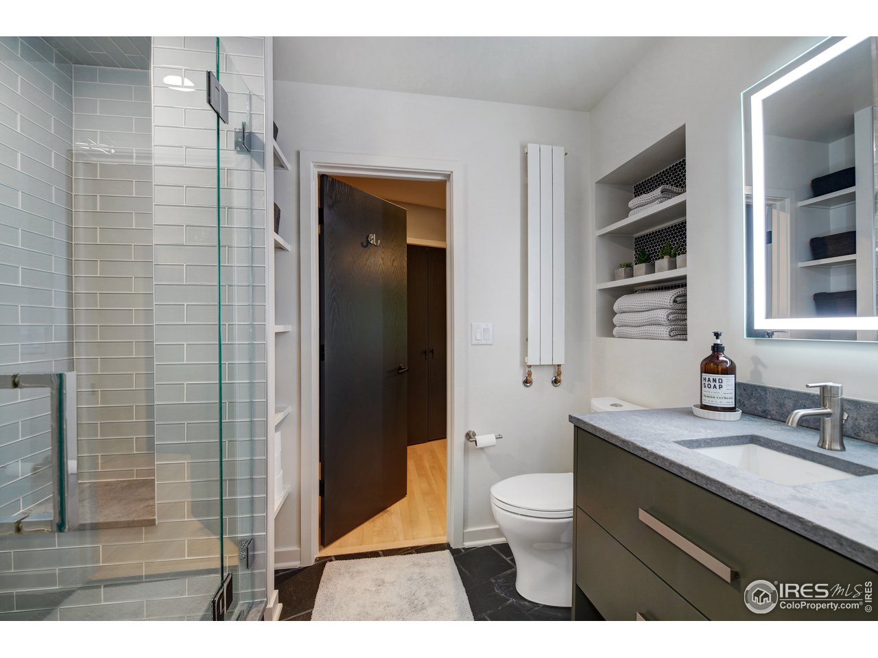 505 Geneva Avenue Boulder, CO 80302 - Photo 28 of 40 a bathroom with a sink a toilet and shower