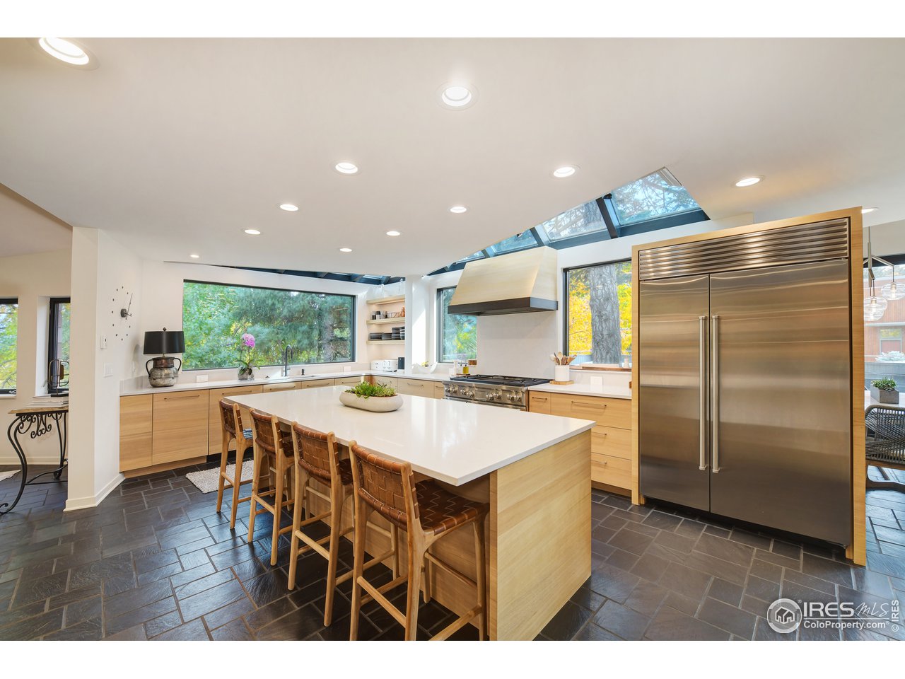 505 Geneva Avenue Boulder, CO 80302 - Photo 6 of 40 a kitchen with kitchen island a sink stove and refrigerator